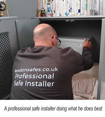 A professional safe installer doing what he does best